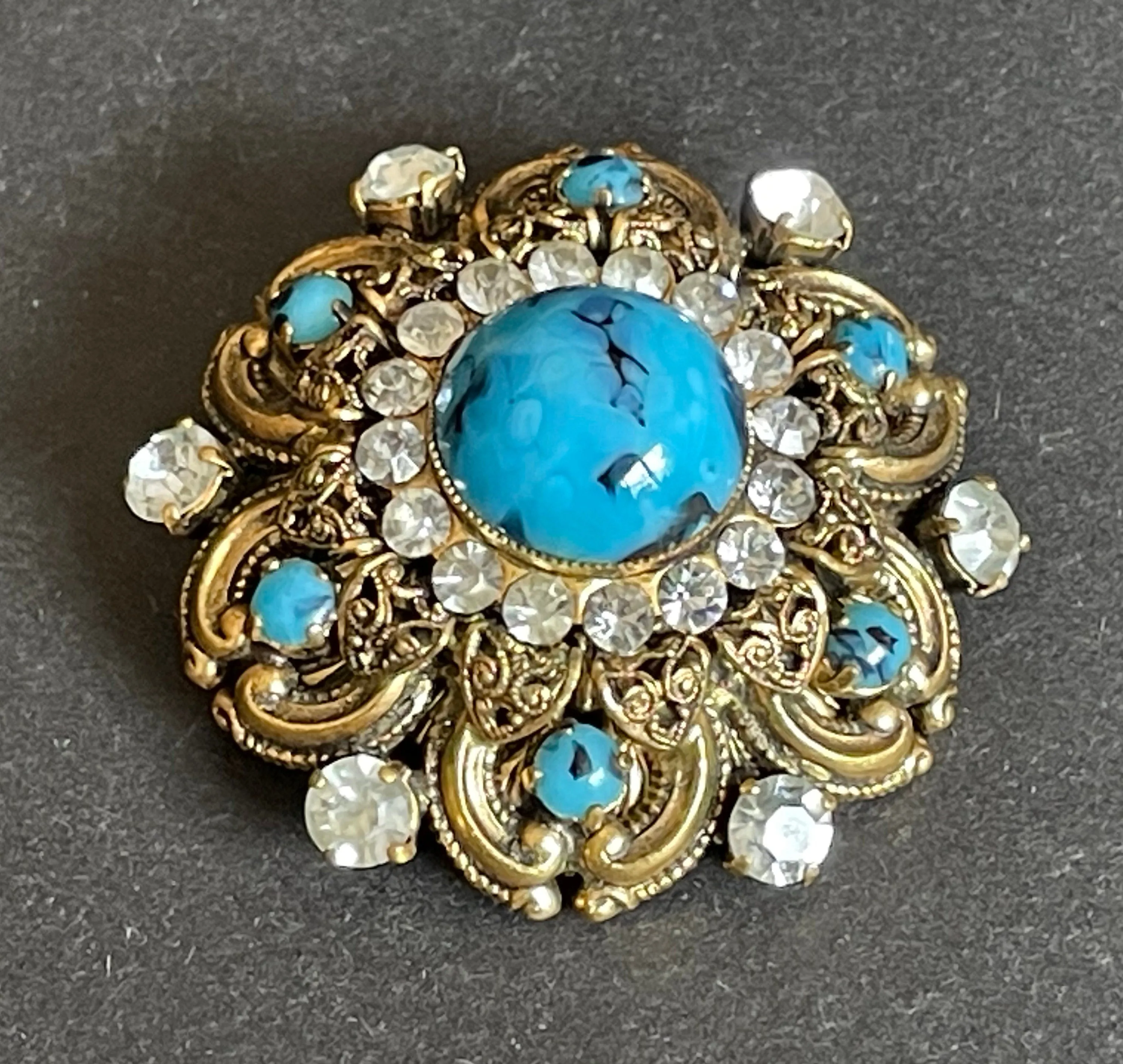 Large vintage Art Deco faux turquoise glass cabochon, clear paste rhinestone and gold tone filigree Czech flower brooch, Max Neiger style